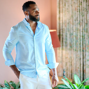 man wearing checked shirt