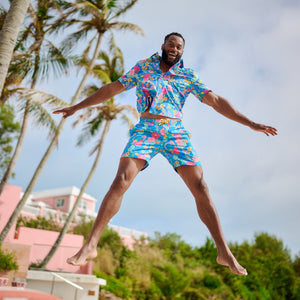 man jumping wearing floral
