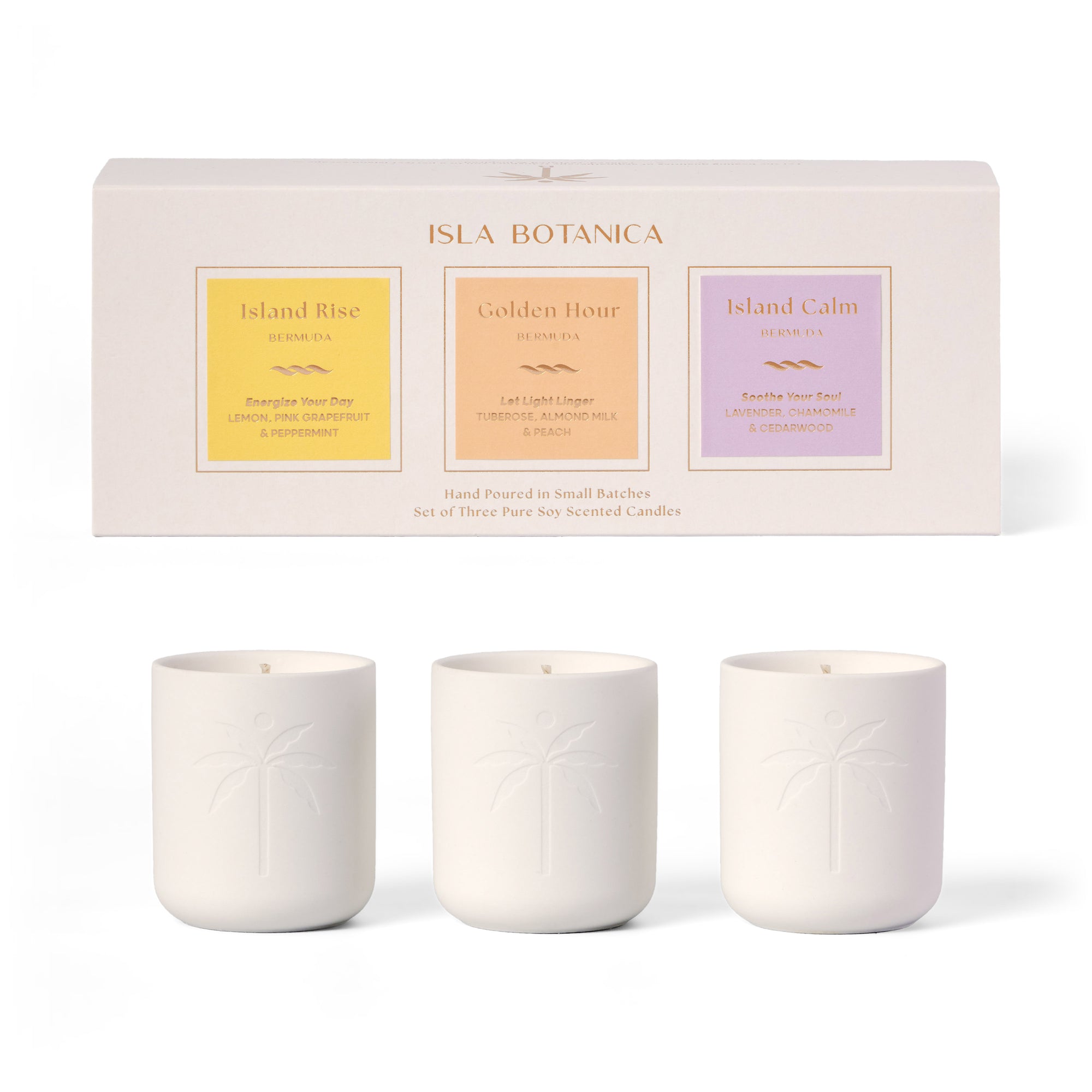 Three candles in white containers with a branded box in the background on a white background
