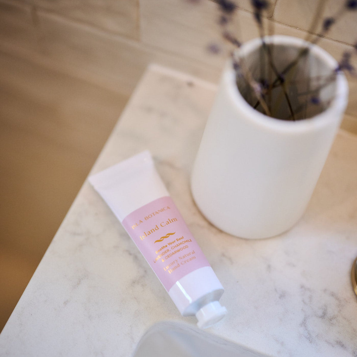 Hand cream on a marble surface with a blurred background